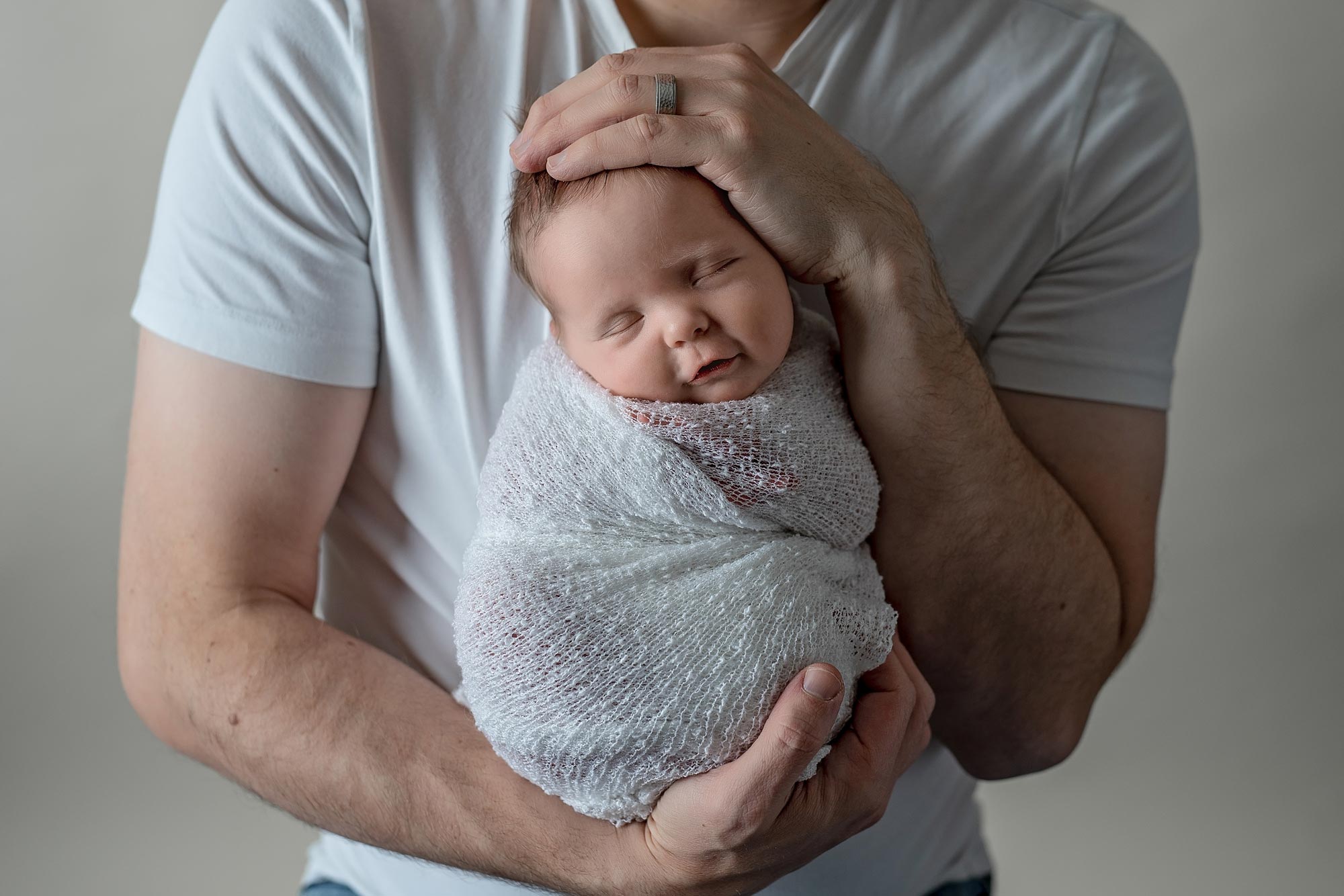 dad holding baby girl